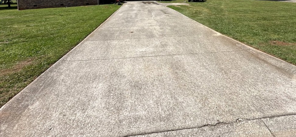 Concrete driveway before pressure washing