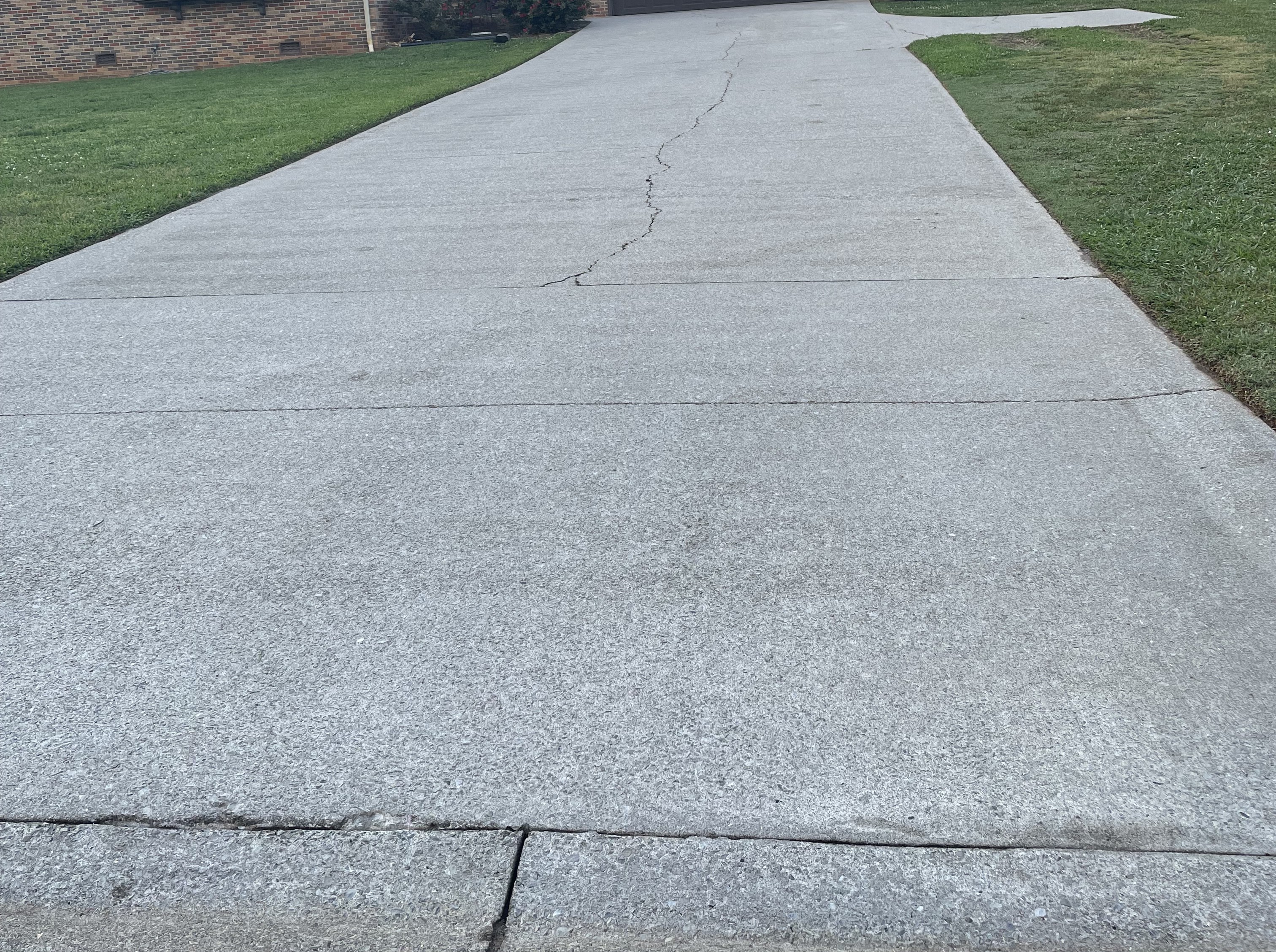 Concrete driveway after pressure washing and sealing